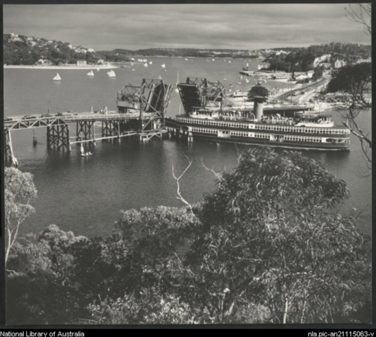 Spit Bridge - Photo By: <a href="Max Dupain, The Old Spit Bridge, 1940s, photograph, National Library of Australia Service Digital Archive, Canberra, <http://nla.gov.au/nla.obj-139497513>, accessed 7 November 2021. ">Showboat Kalang going through the old bridge in the 1940s</a>